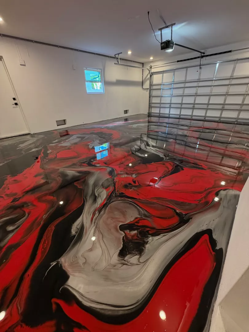 Glossy red, black, and silver metallic floor in a garage